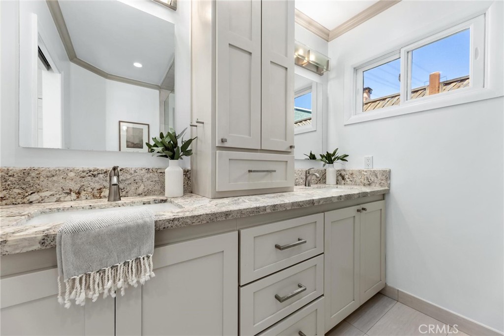 3219 Gibson Place Redondo Beach, CA 90278 - Photo 33 of 47 a bathroom with a granite countertop sink and a mirror