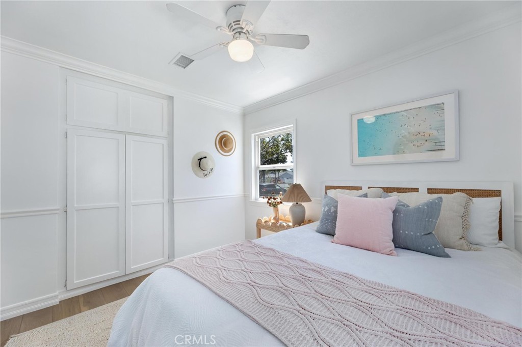 3219 Gibson Place Redondo Beach, CA 90278 - Photo 35 of 47 a bedroom with a large bed and a chandelier
