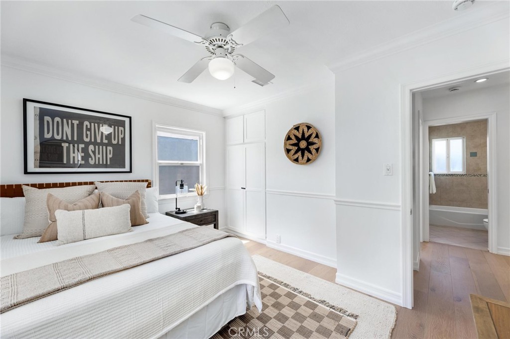 3219 Gibson Place Redondo Beach, CA 90278 - Photo 37 of 47 a bedroom with a large bed and a chandelier