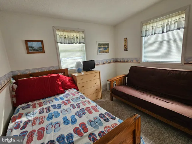 a bed room with a bed and a couch