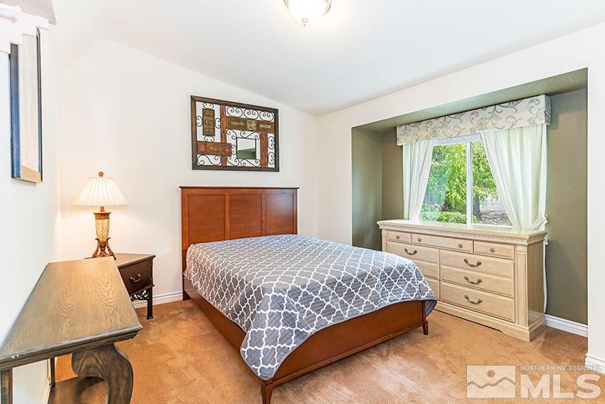 14345 Chamy Drive Reno, NV 89521 - Photo 13 of 15 a bedroom with a bed and a window