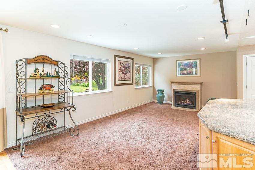 14345 Chamy Drive Reno, NV 89521 - Photo 14 of 15 a view of livingroom with furniture a fireplace and windows