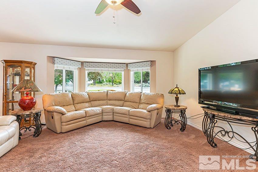 14345 Chamy Drive Reno, NV 89521 - Photo 2 of 15 a living room with furniture and a flat screen tv