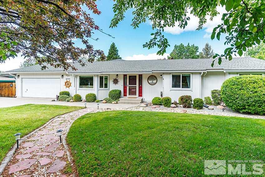 14345 Chamy Drive Reno, NV 89521 - Photo 6 of 15 a front view of a house with a garden