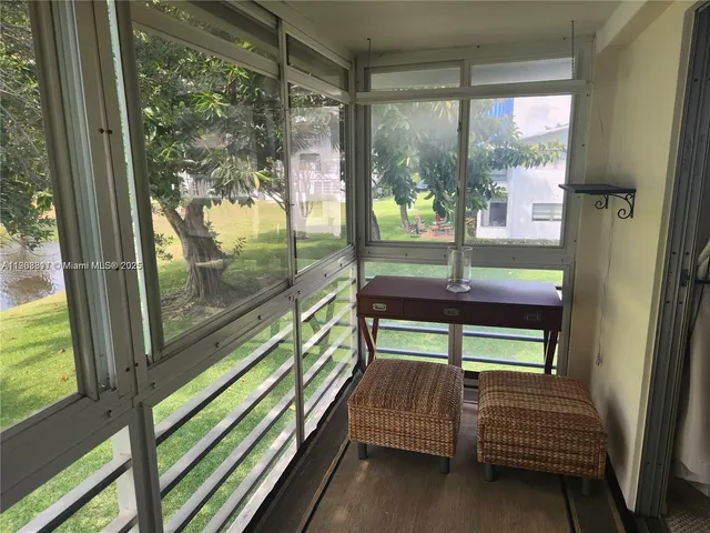 a sitting area with large window