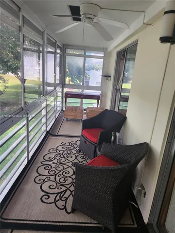 a room with furniture and a large window