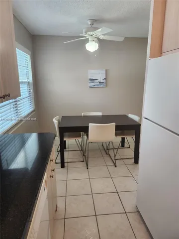 a workspace with furniture and a chandelier