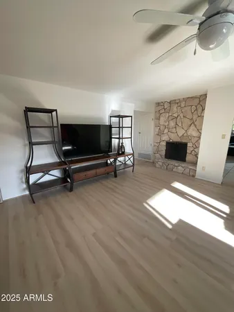 a living room with furniture and a fireplace