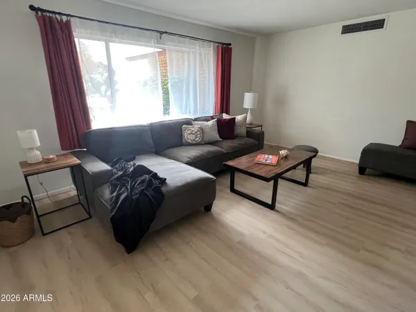 a living room with furniture and a window