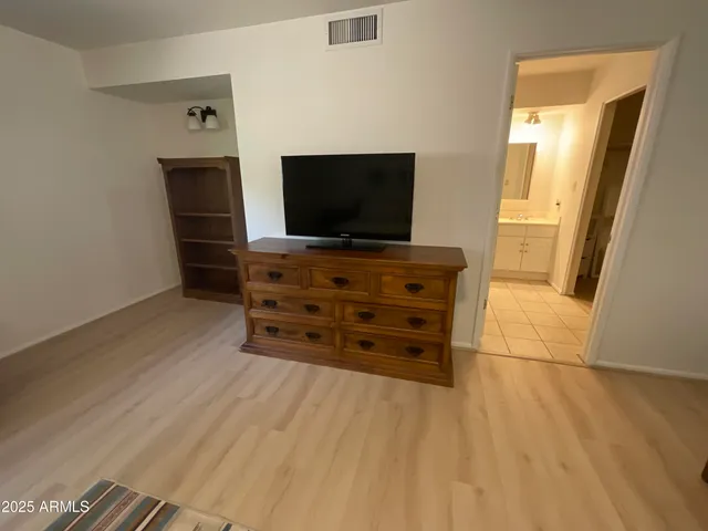 a bathroom with a tub and a sink