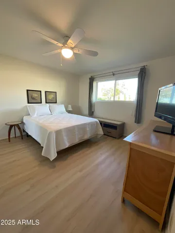 a bedroom with a bed and window