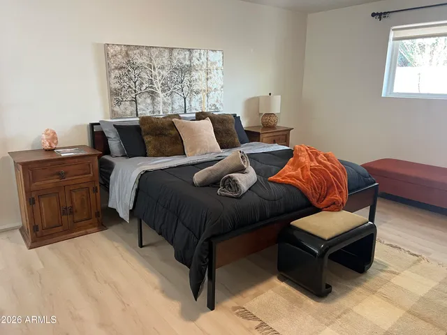 a bedroom with a bed and window