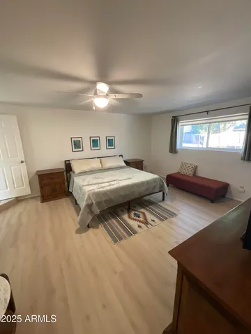 a living room with furniture and chandelier