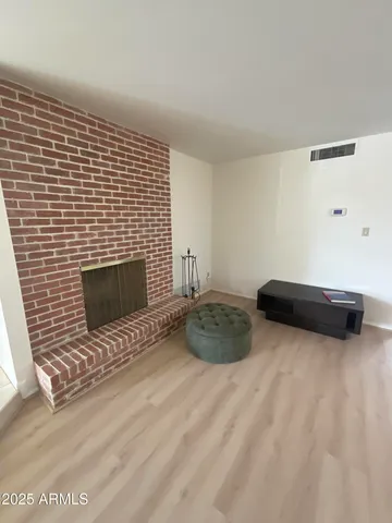 a bedroom with a bed and a fireplace