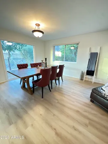 a view of a dining room with furniture window and outside view