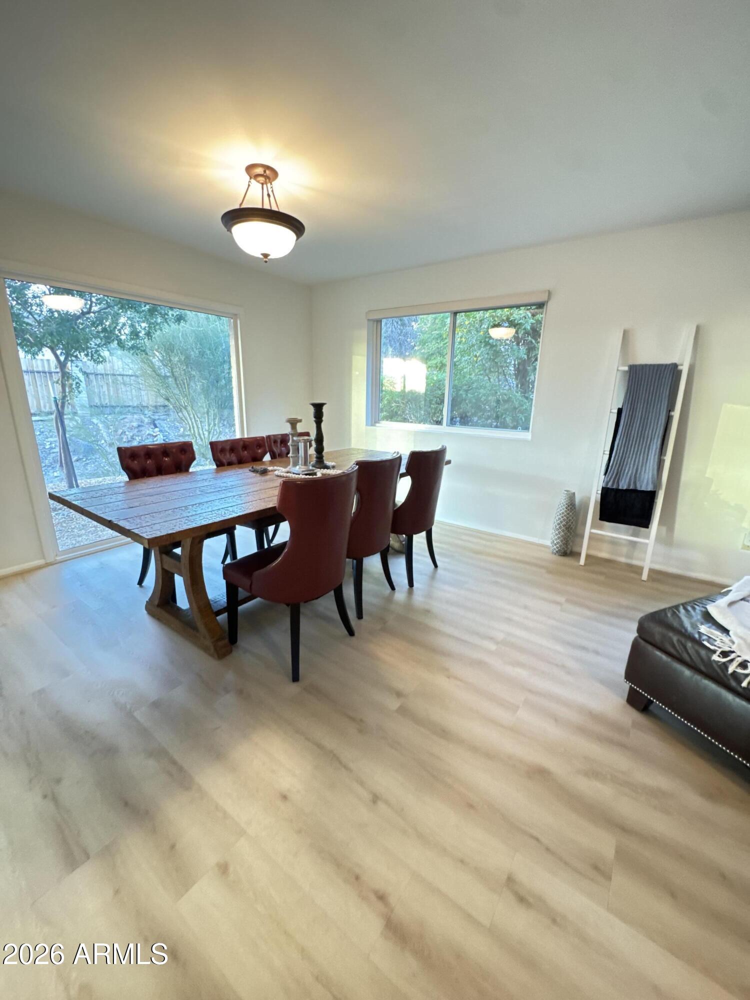 6802 North 26th Street Phoenix, AZ 85016 - Photo 7 of 39 a view of a dining room with furniture window and outside view