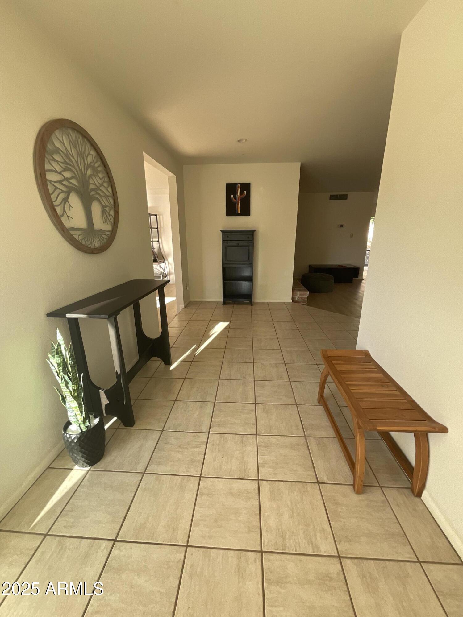 6802 North 26th Street Phoenix, AZ 85016 - Photo 9 of 39 a view of a livingroom with furniture and a hallway