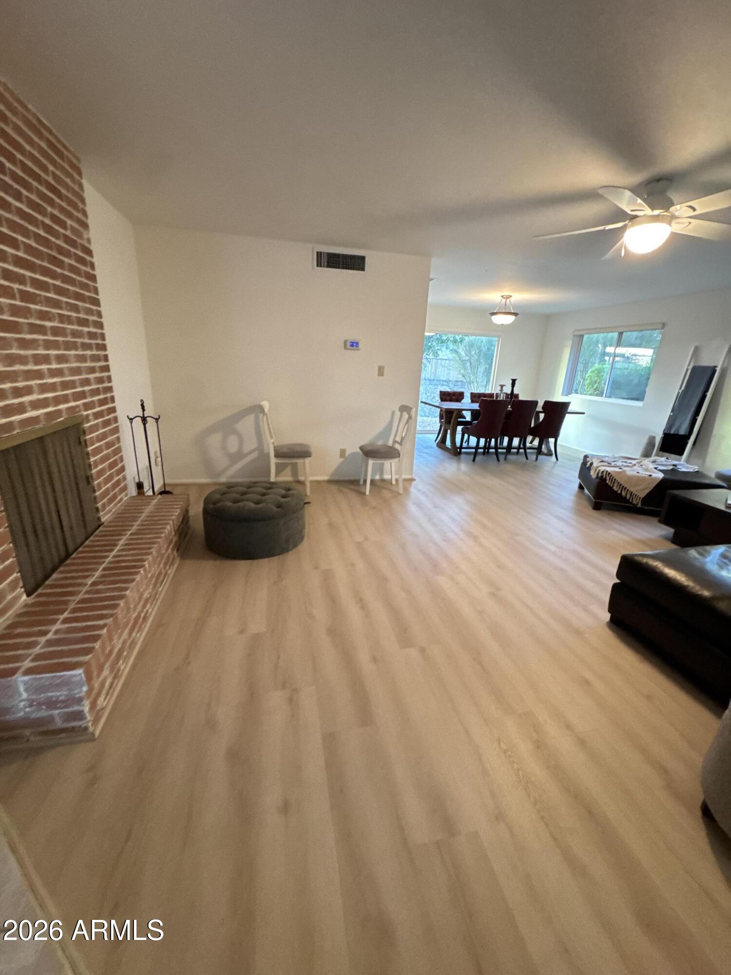 6802 North 26th Street Phoenix, AZ 85016 - Photo 10 of 39 a living room with furniture and a wooden floor