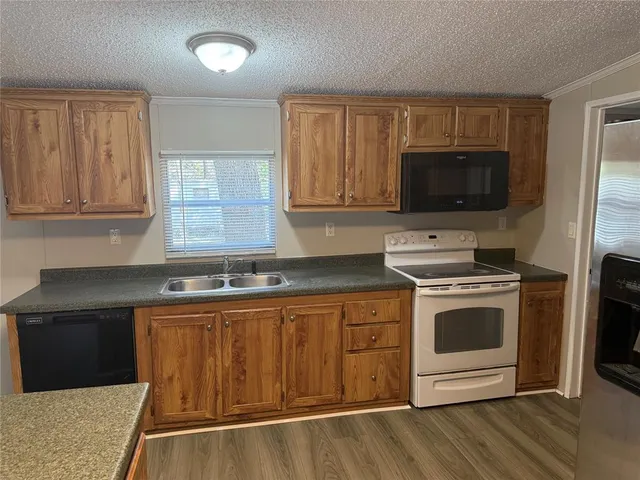 a kitchen with a stove and a microwave