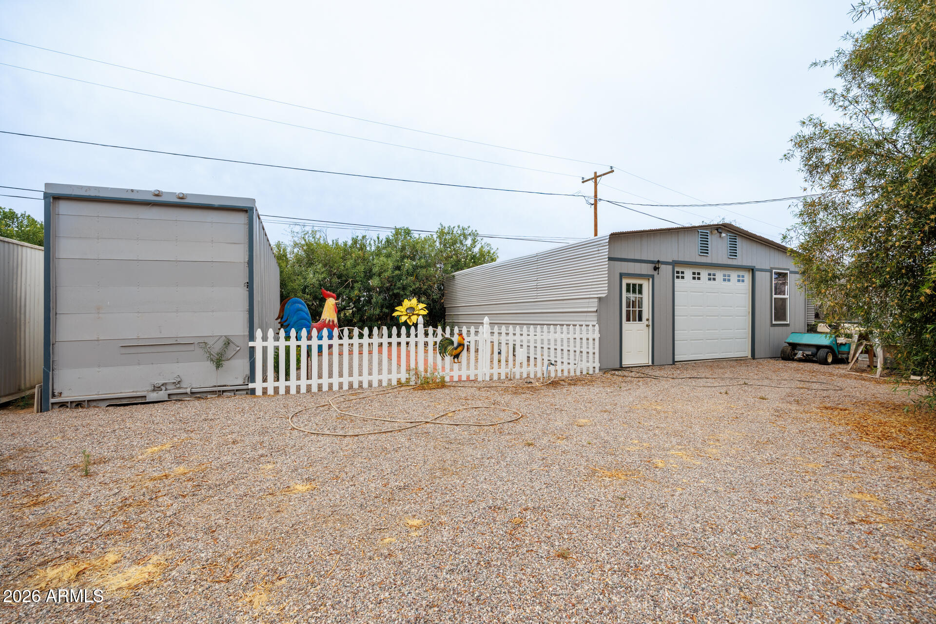 6185 East Monitor Street Picacho, AZ 85141 - Photo 16 of 55 a view of a house with a yard and garage