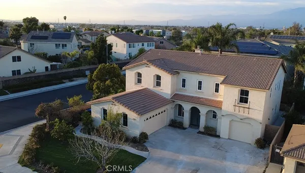 a aerial view of a house with a yard