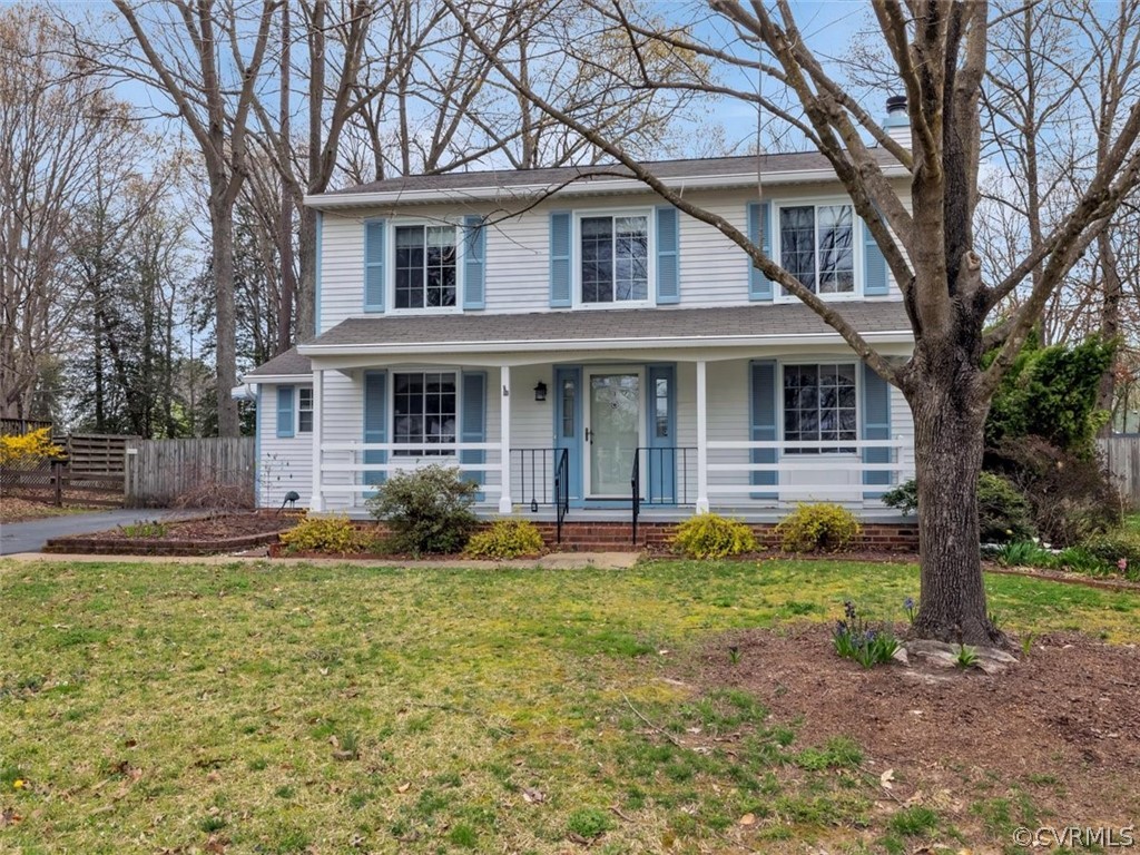 6428 Husting Road Chesterfield, VA 23832 - Photo 23 of 24 a front view of a house with garden and trees