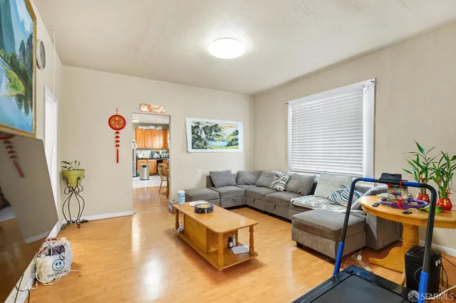 a kitchen with stainless steel appliances granite countertop a refrigerator and a stove