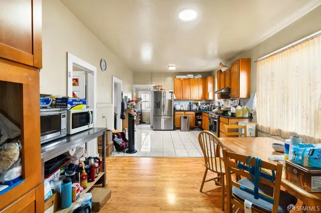 a view of a hallway with closet and a window