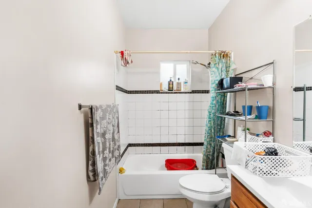 a bed room with a bed and a chandelier