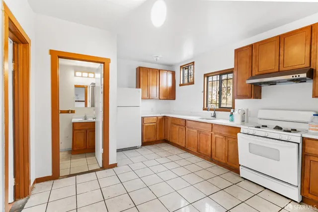 a bathroom with a sink a mirror and vanity