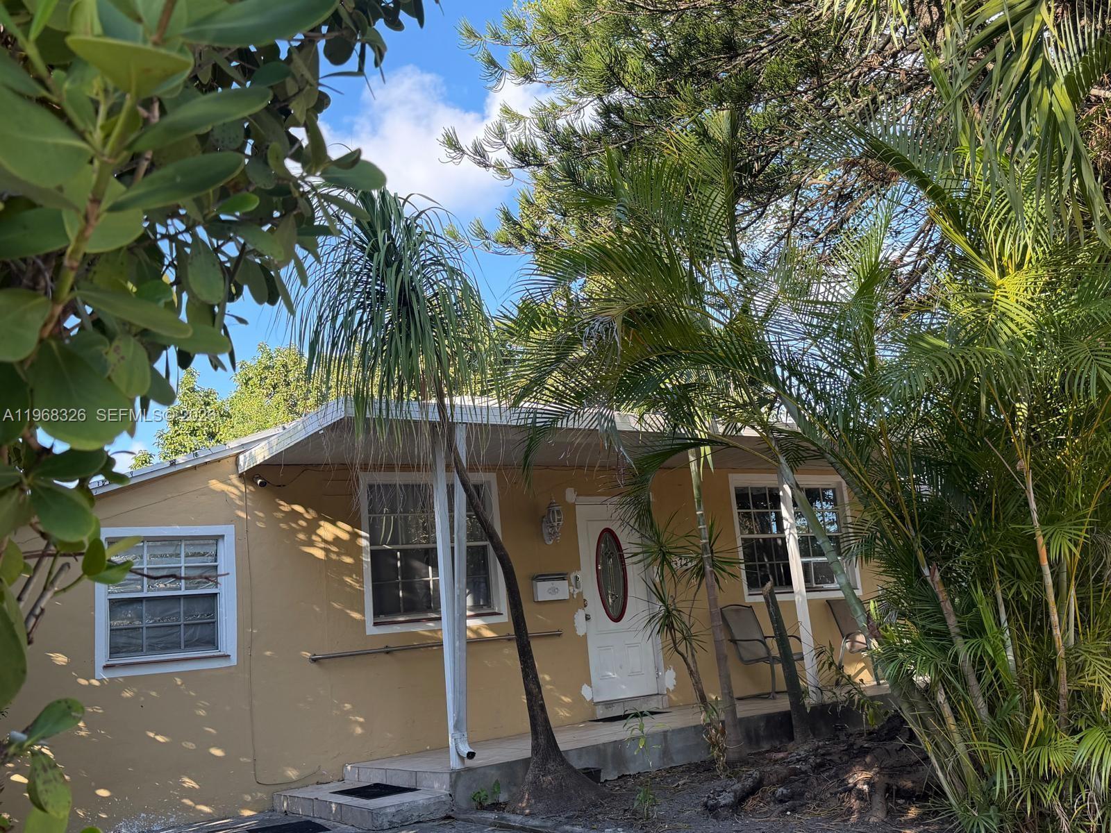 4729 Southwest 4th Street Miami, FL 33134 - Photo 4 of 4 a view of a house with a yard