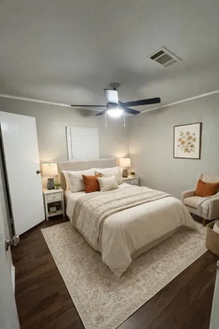 a bedroom with bed and window