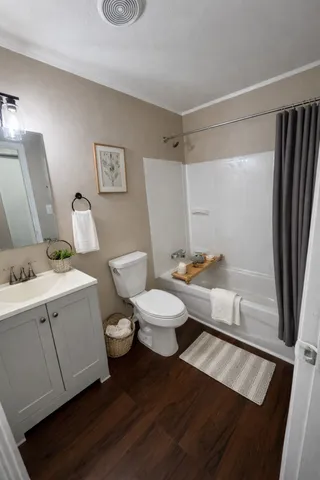 a bathroom with a toilet a sink and a bathtub