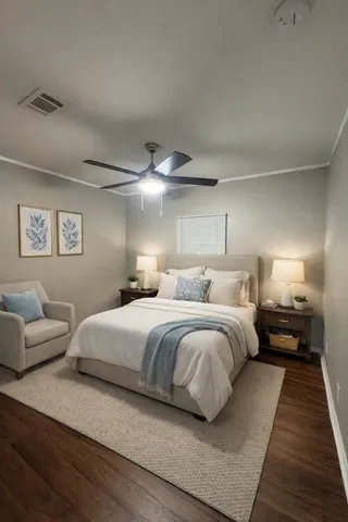 a bedroom with a bed and a couch