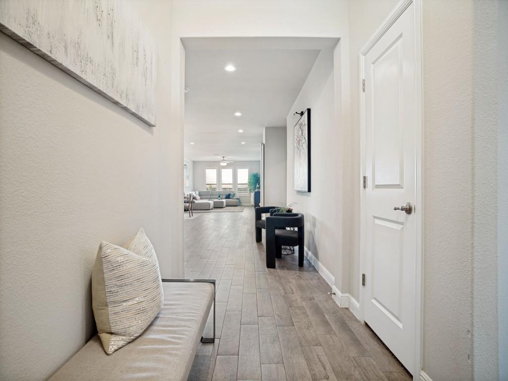 1612 Reed Drive Krum, TX 76249 - Photo 4 of 25 Entryway featuring wood-finish flooring, recessed lighting, and a white paneled door