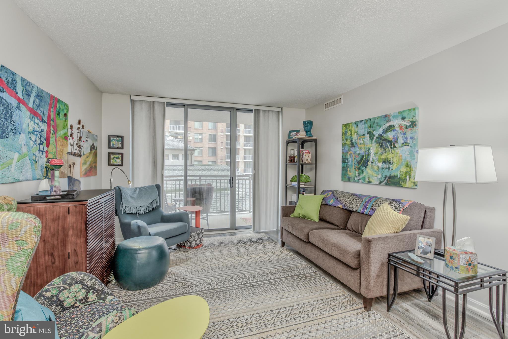 11710 Old Georgetown Road, Unit 422 North Bethesda, MD 20852 - Photo 11 of 28 a living room with furniture and a large window