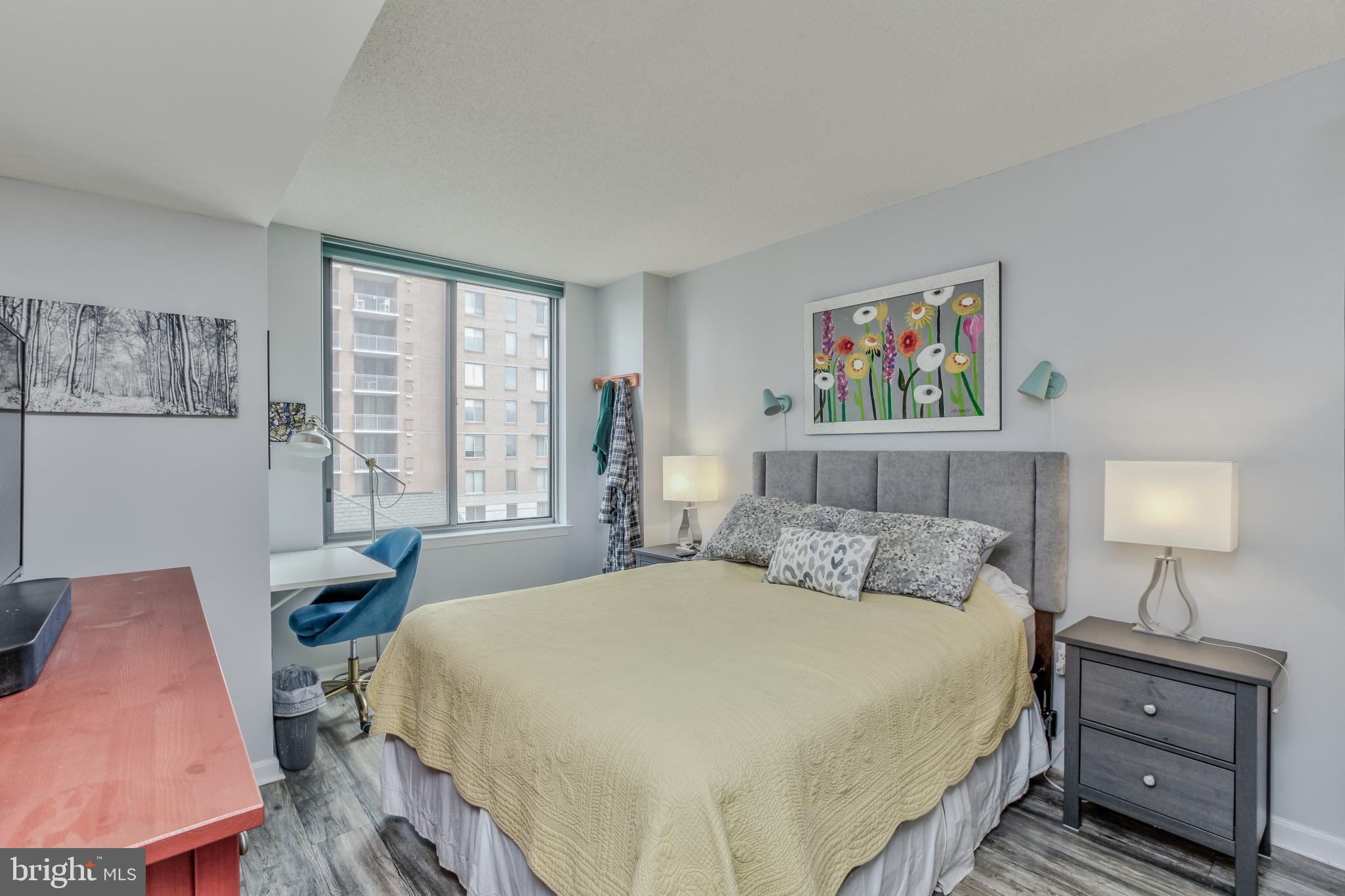 11710 Old Georgetown Road, Unit 422 North Bethesda, MD 20852 - Photo 14 of 28 a bedroom with a bed a dresser next to a window