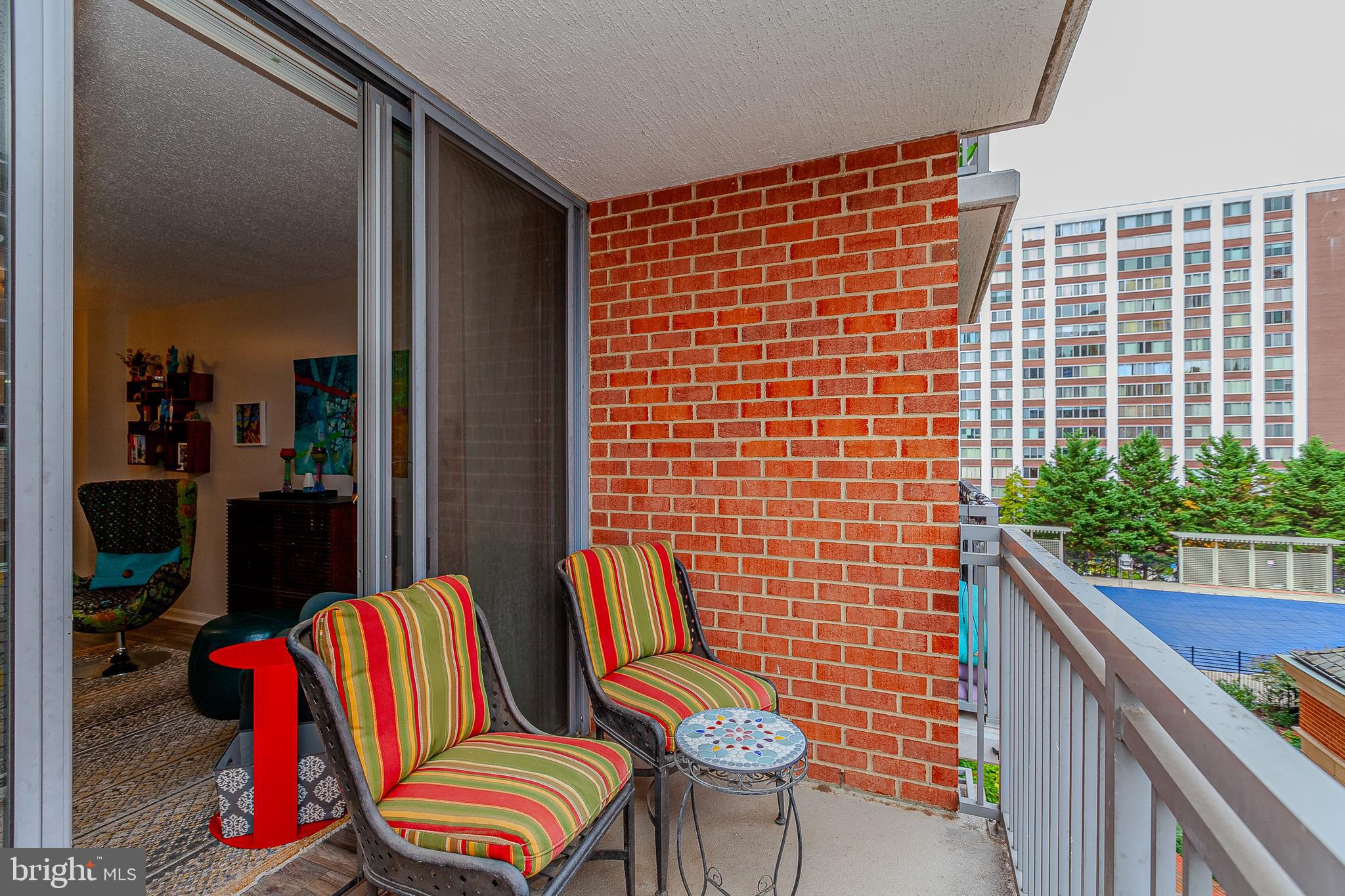 11710 Old Georgetown Road, Unit 422 North Bethesda, MD 20852 - Photo 21 of 28 a view of a balcony with chairs and a potted plant