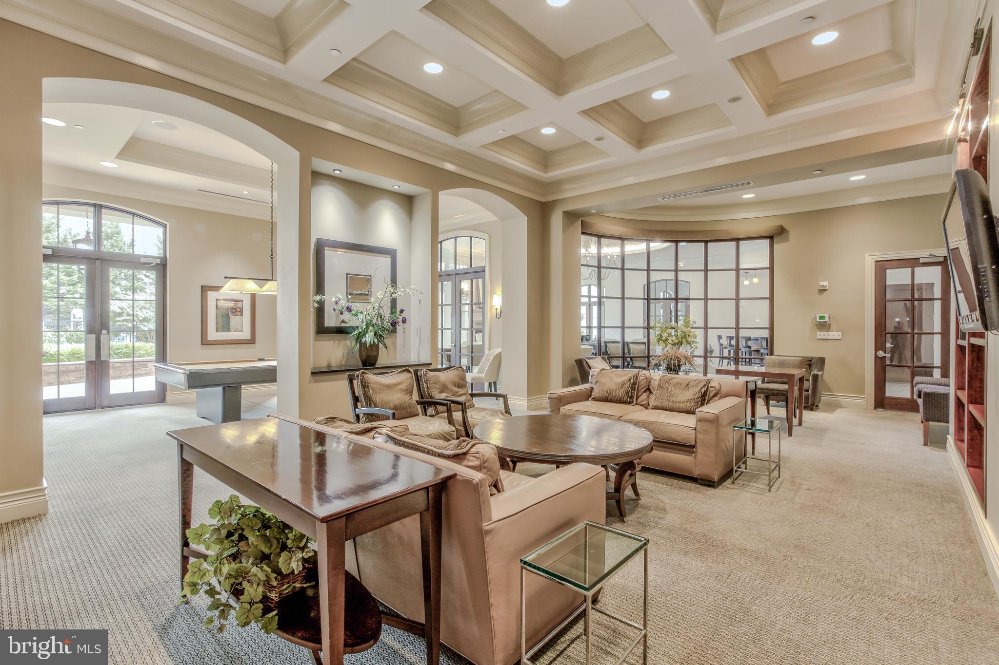11710 Old Georgetown Road, Unit 422 North Bethesda, MD 20852 - Photo 23 of 28 a living room with furniture and a large window