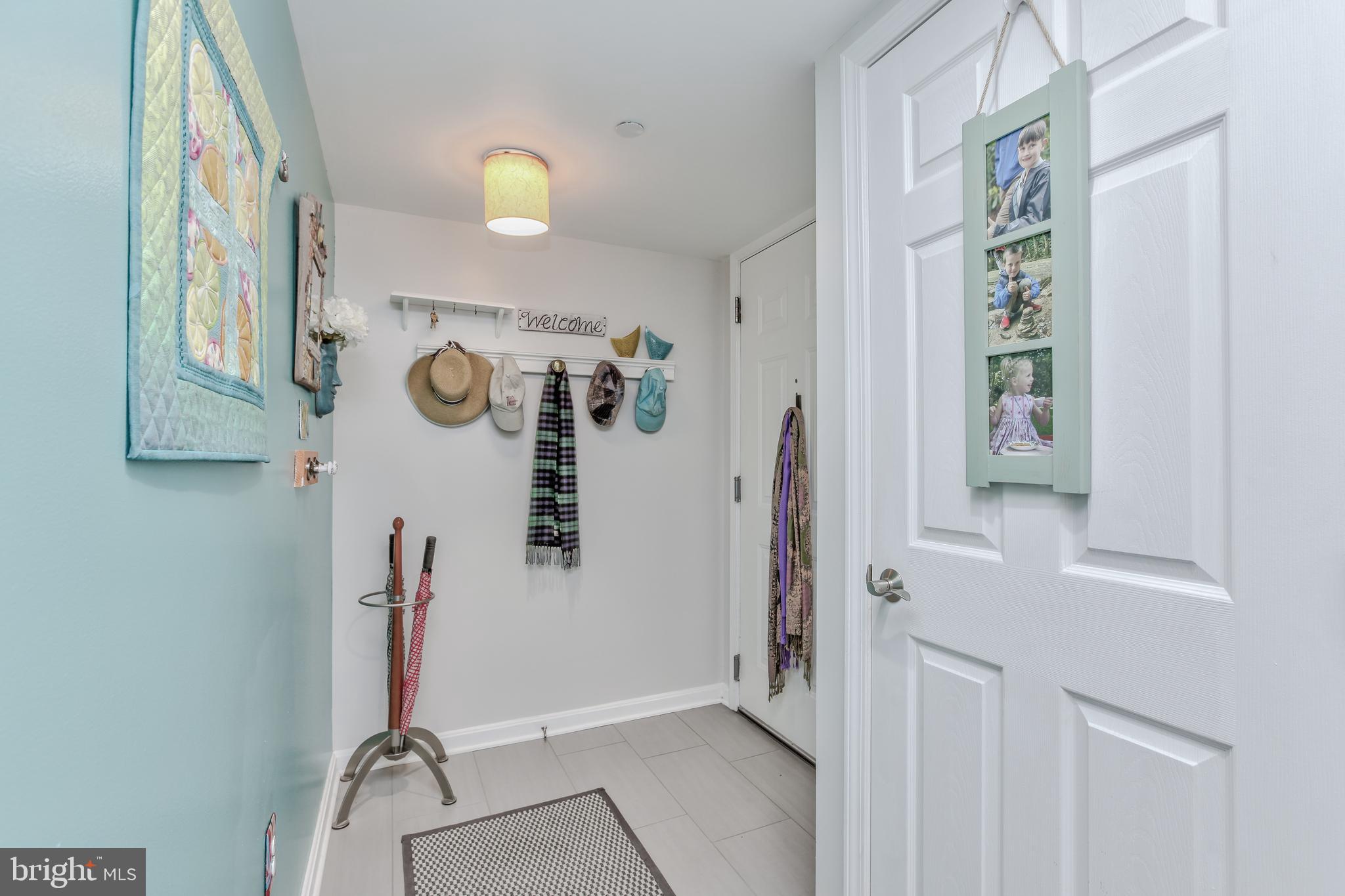 11710 Old Georgetown Road, Unit 422 North Bethesda, MD 20852 - Photo 3 of 28 view of a hallway with paintings on the wall
