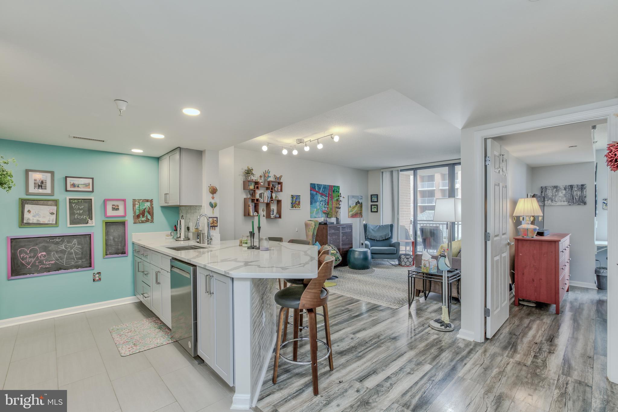 11710 Old Georgetown Road, Unit 422 North Bethesda, MD 20852 - Photo 4 of 28 a large kitchen with a table and chairs in it