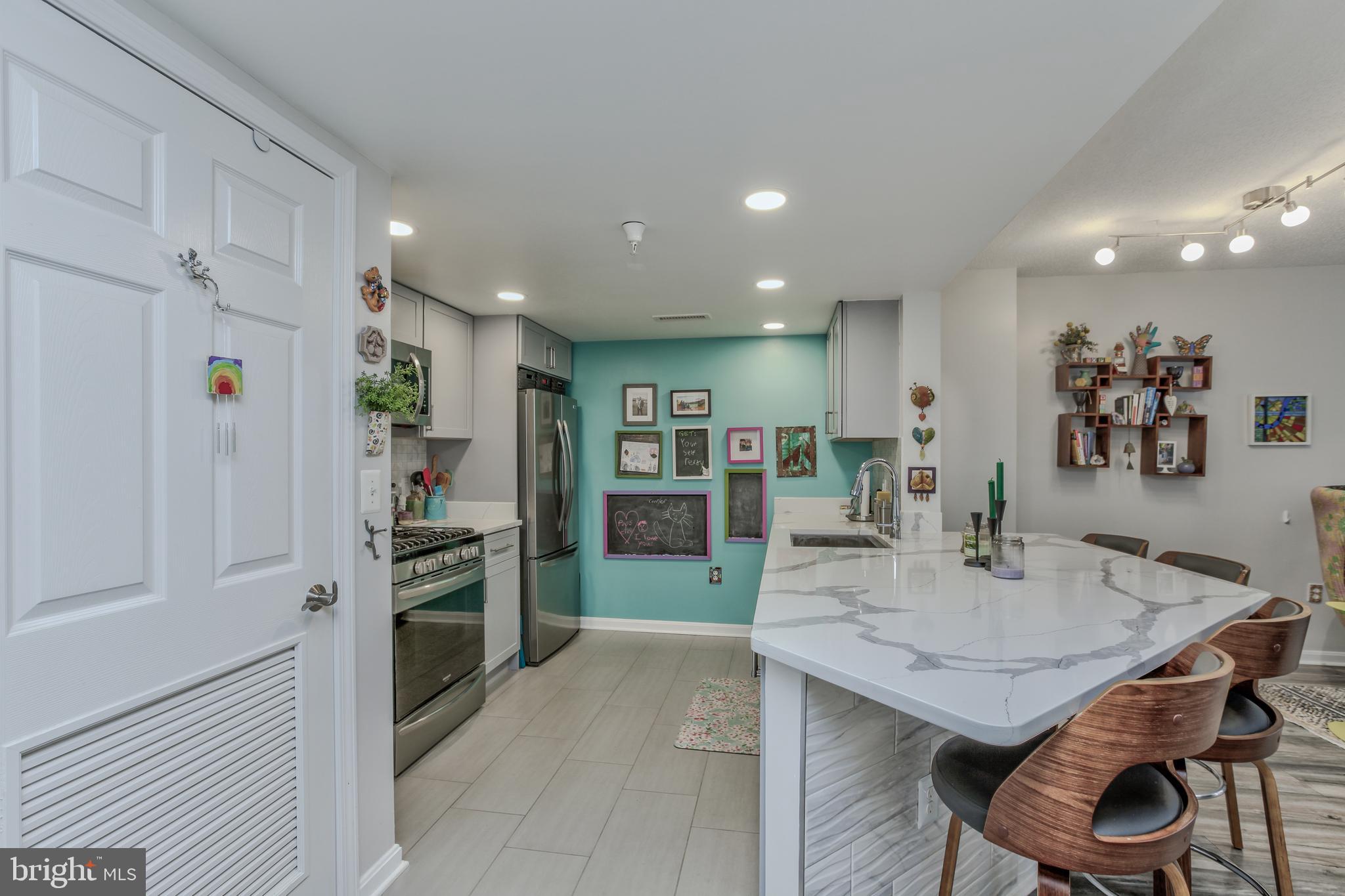 11710 Old Georgetown Road, Unit 422 North Bethesda, MD 20852 - Photo 5 of 28 a kitchen with a table and chairs in it