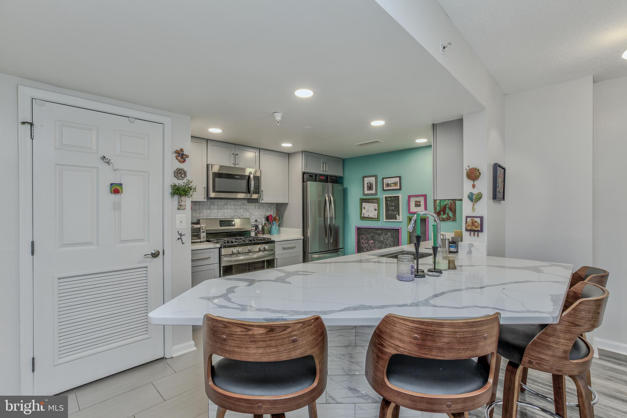 11710 Old Georgetown Road, Unit 422 North Bethesda, MD 20852 - Photo 6 of 28 a kitchen with a table and chairs in it