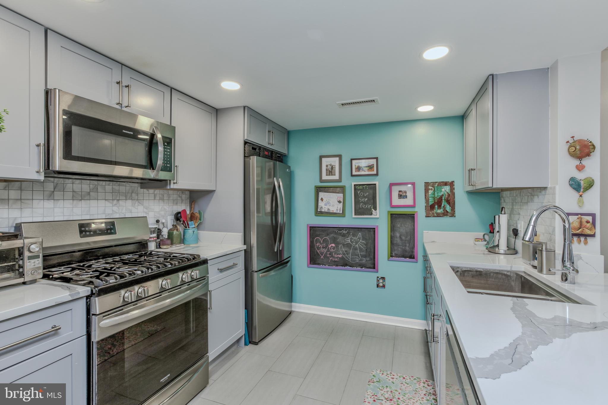 11710 Old Georgetown Road, Unit 422 North Bethesda, MD 20852 - Photo 7 of 28 a kitchen with stainless steel appliances granite countertop a refrigerator sink and stove