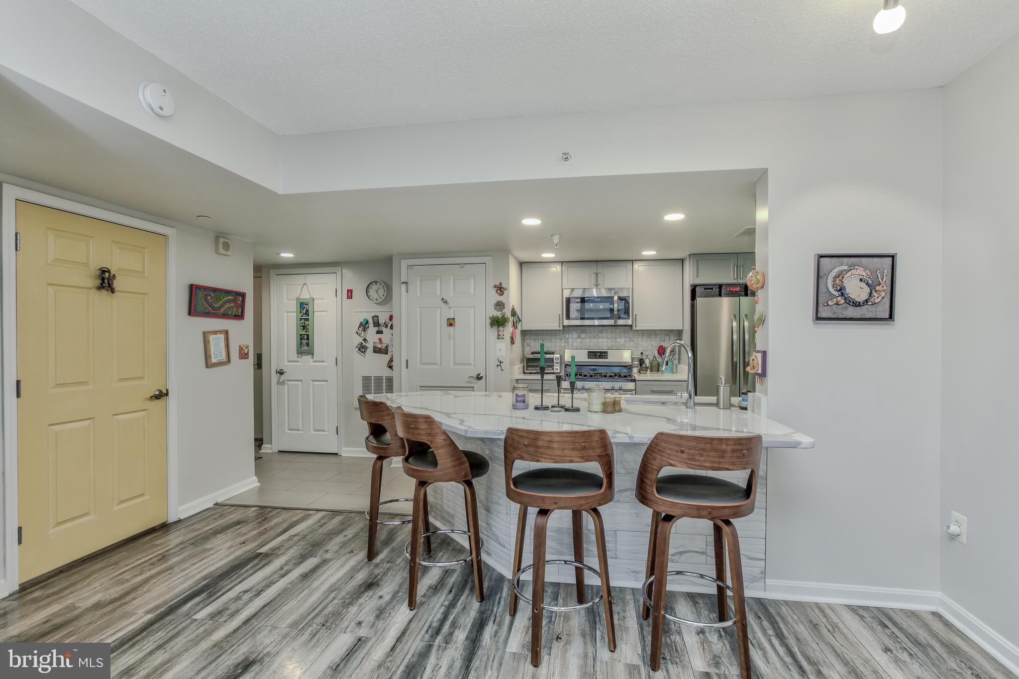 11710 Old Georgetown Road, Unit 422 North Bethesda, MD 20852 - Photo 10 of 28 a view of a dining room with furniture