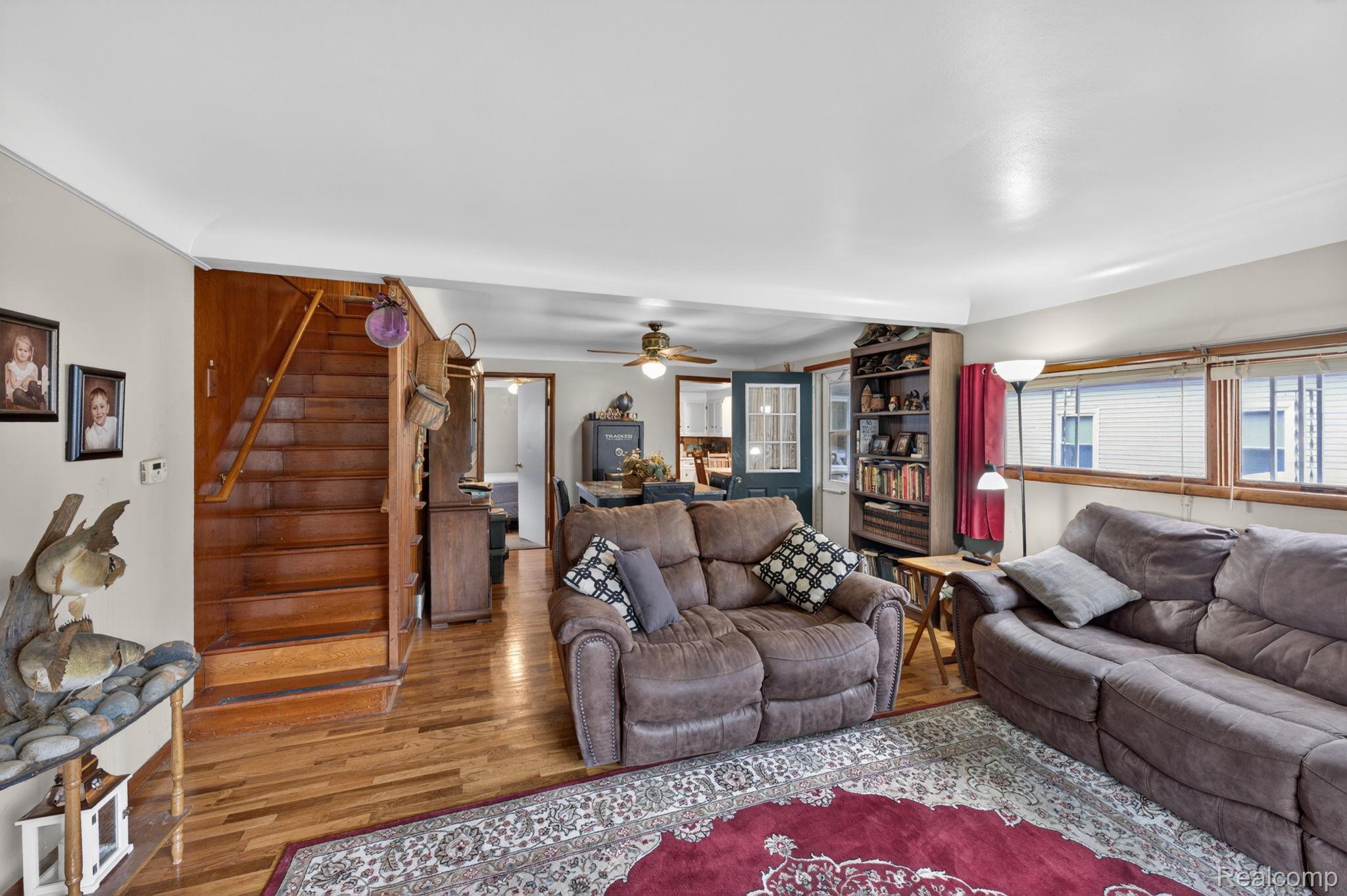 304 West Ridge Street Owosso, MI 48867 - Photo 8 of 45 Living room featuring wood finished floors and ceiling fan