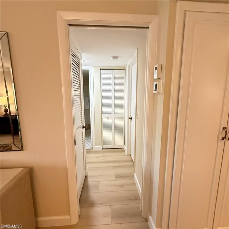 57 High Point Circle West, Unit 201 Naples, FL 34103 - Photo 11 of 18 a view of a front door of a house