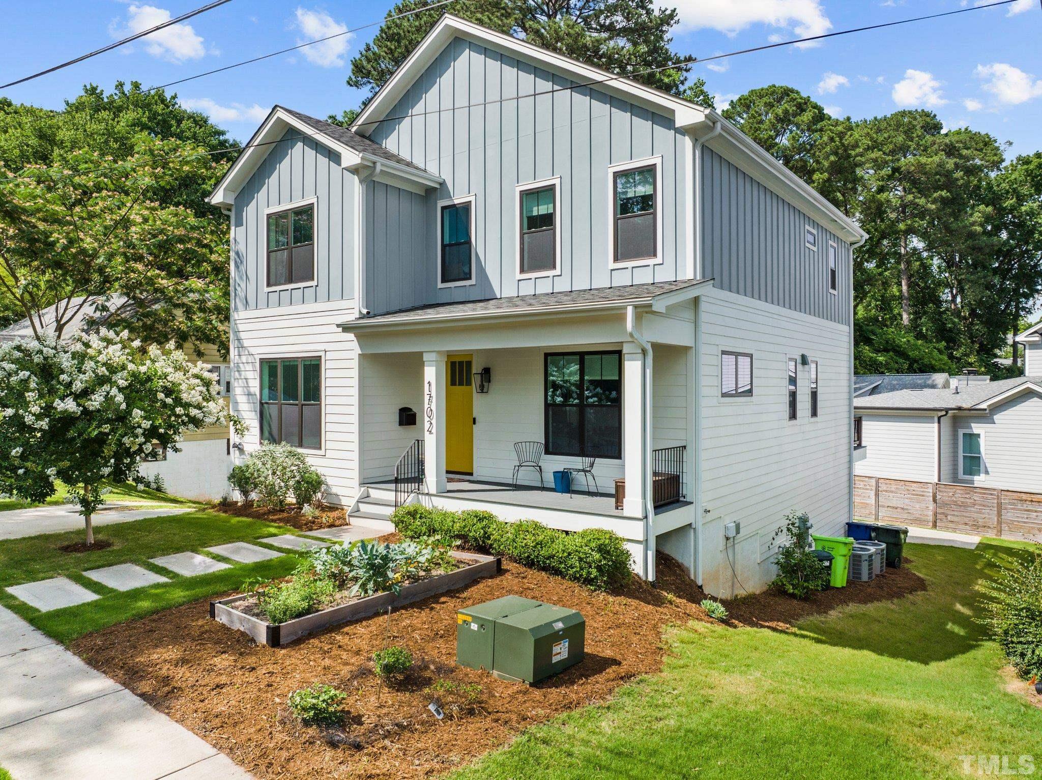1702 Bickett Boulevard Raleigh, NC 27608 - Photo 1 of 41 front view of a house with a yard