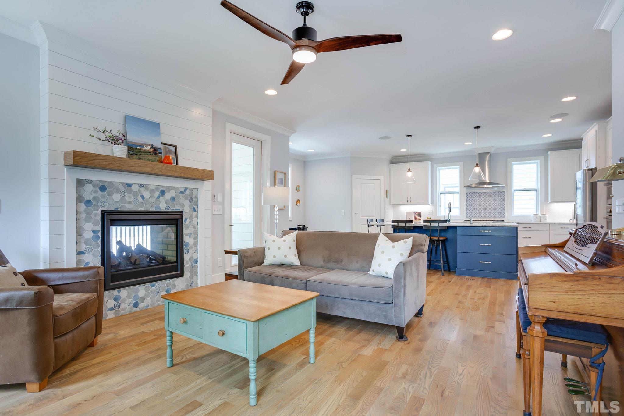 1702 Bickett Boulevard Raleigh, NC 27608 - Photo 13 of 41 a living room with furniture and a fireplace