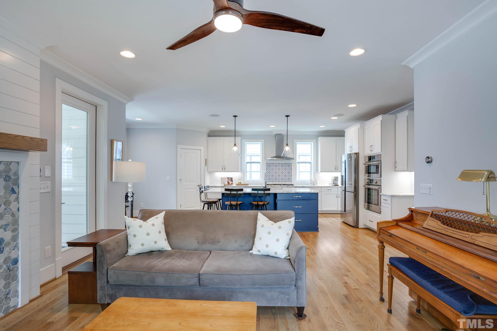 1702 Bickett Boulevard Raleigh, NC 27608 - Photo 15 of 41 a living room with furniture and kitchen view
